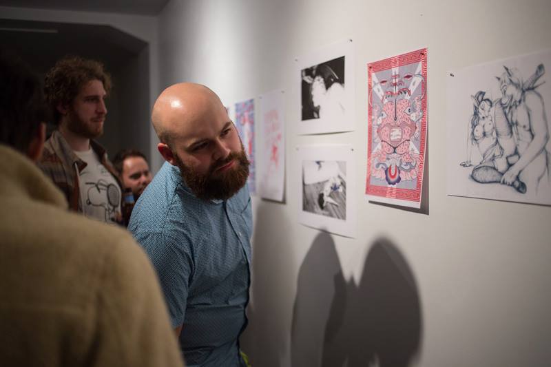 Ben Cowan looking at Lucia Love's Risograph Print NSFW, Risograph Print Show